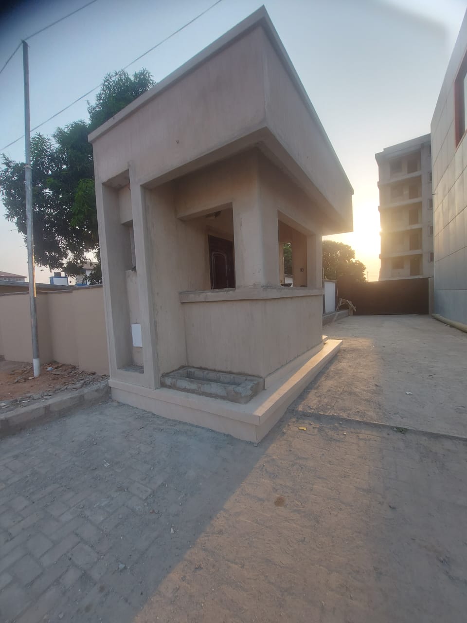 Side view of small plastered building — masonry and construction work by Mr. Aziz Adbul