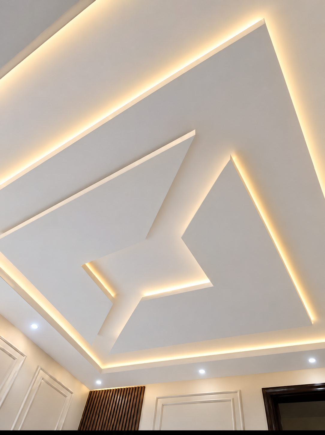 Completed geometric POP ceiling with warm lighting, installed by Mr. Felix