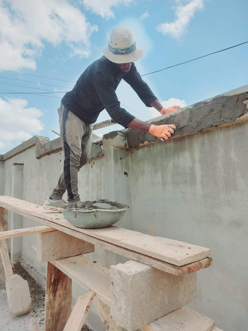 Wall finishing in progress — masonry and construction work by Mr. Aziz Adbul