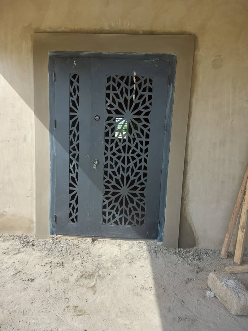 Double doorway with plastered surround — masonry and construction work by Mr. Aziz Adbul